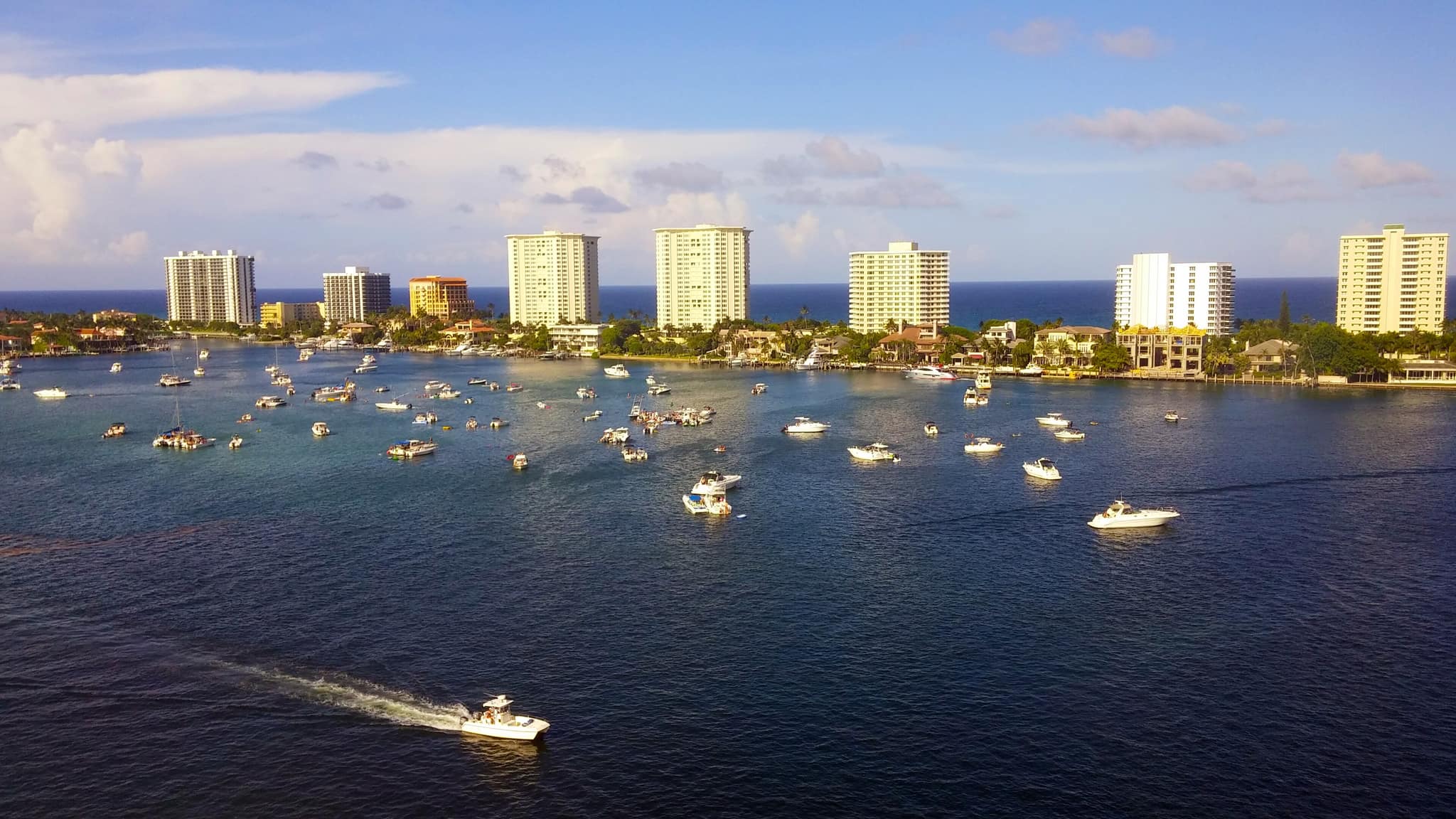 Boats on Lake Boca with the Boca Raton condominium towers behind