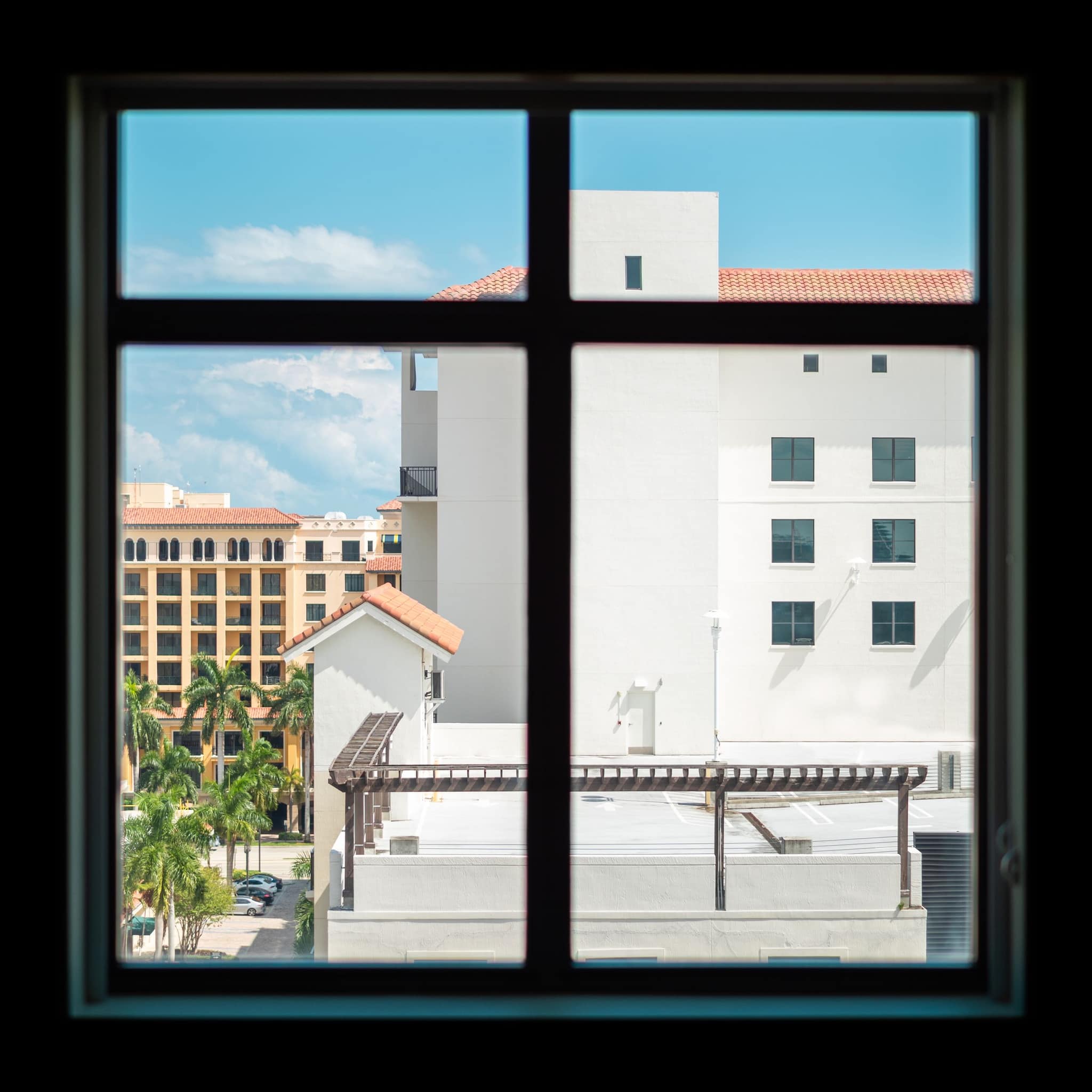 Mediterranean rooftops in Boca Raton through a window