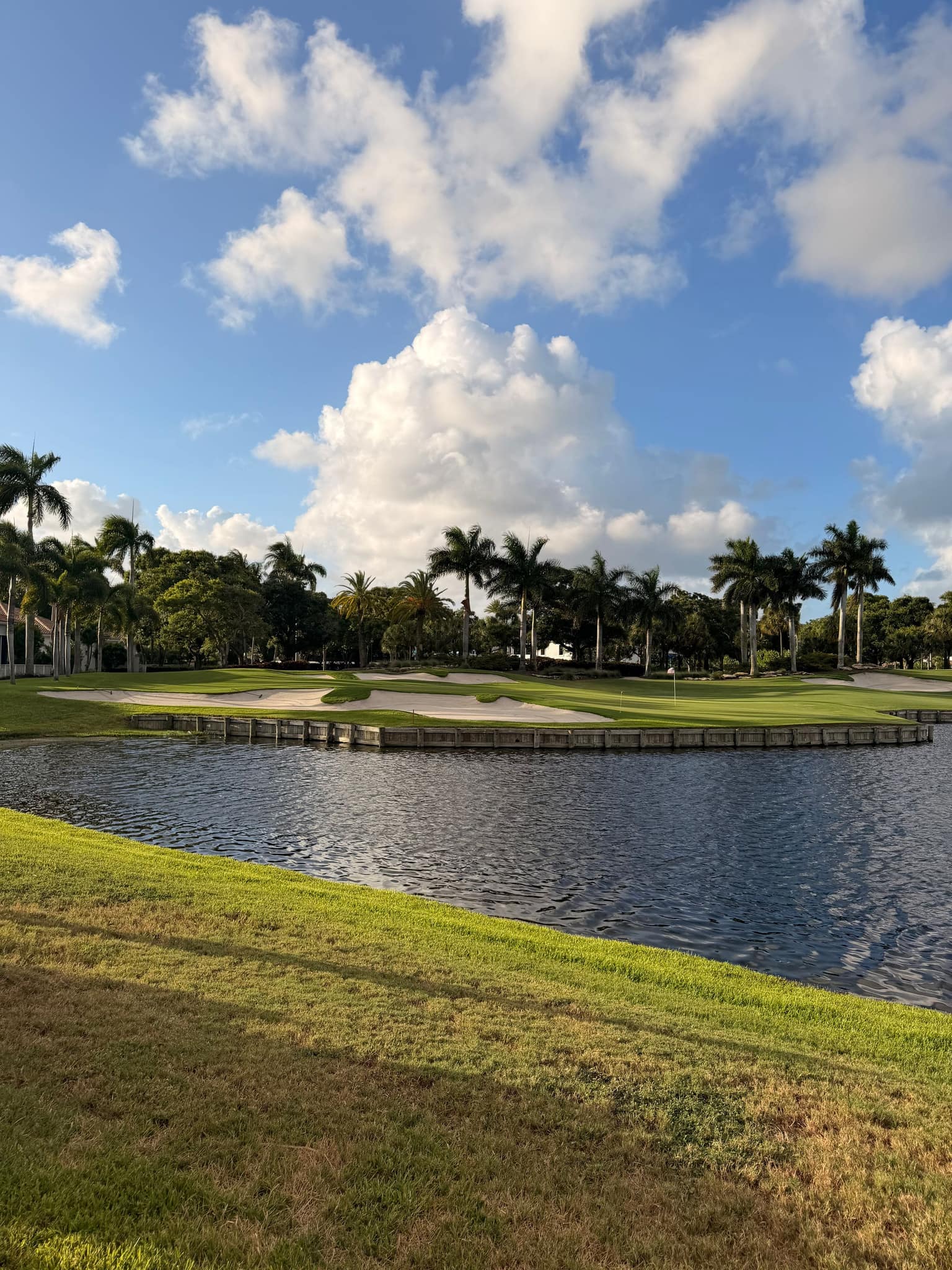 Bunkers and a water feature on a Palm Beach County course
