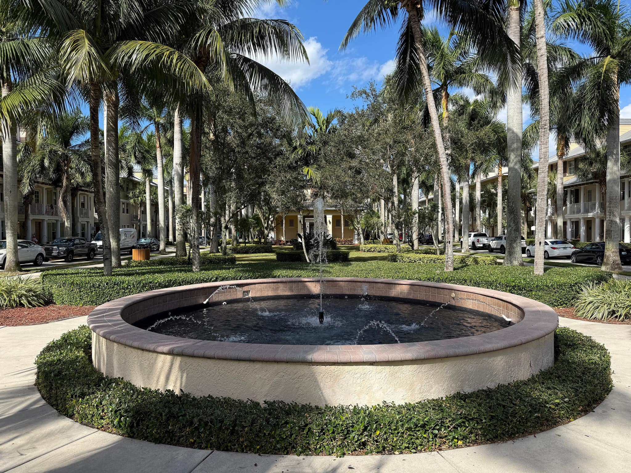 A fountain court among palms in Abacoa, Jupiter